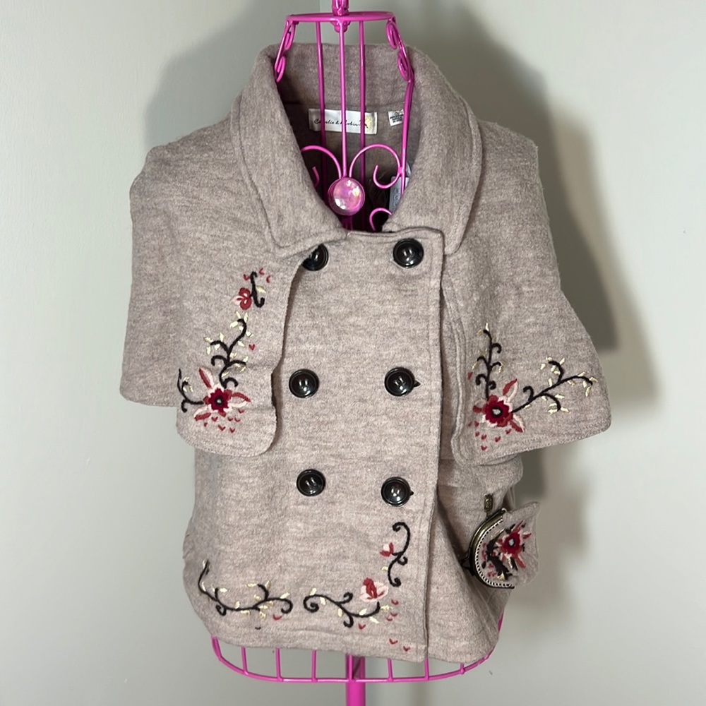 Woman’s fall capelet sweater